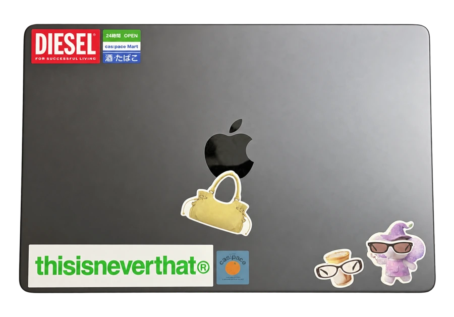 Emily’s closed laptop covered in stickers.